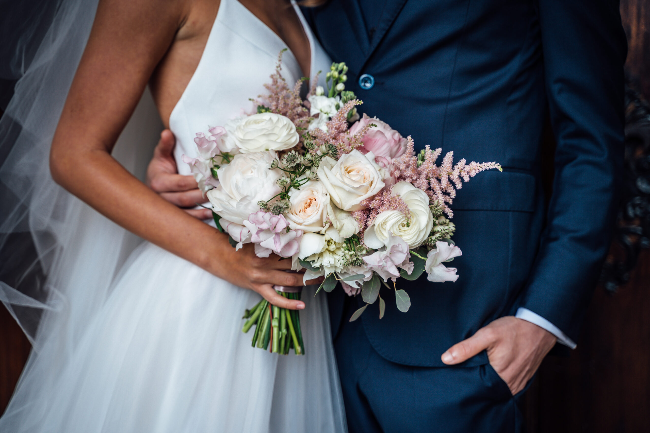 Wedding,Bouquet,Of,White,And,Pink,Roses,And,With,Newlywed